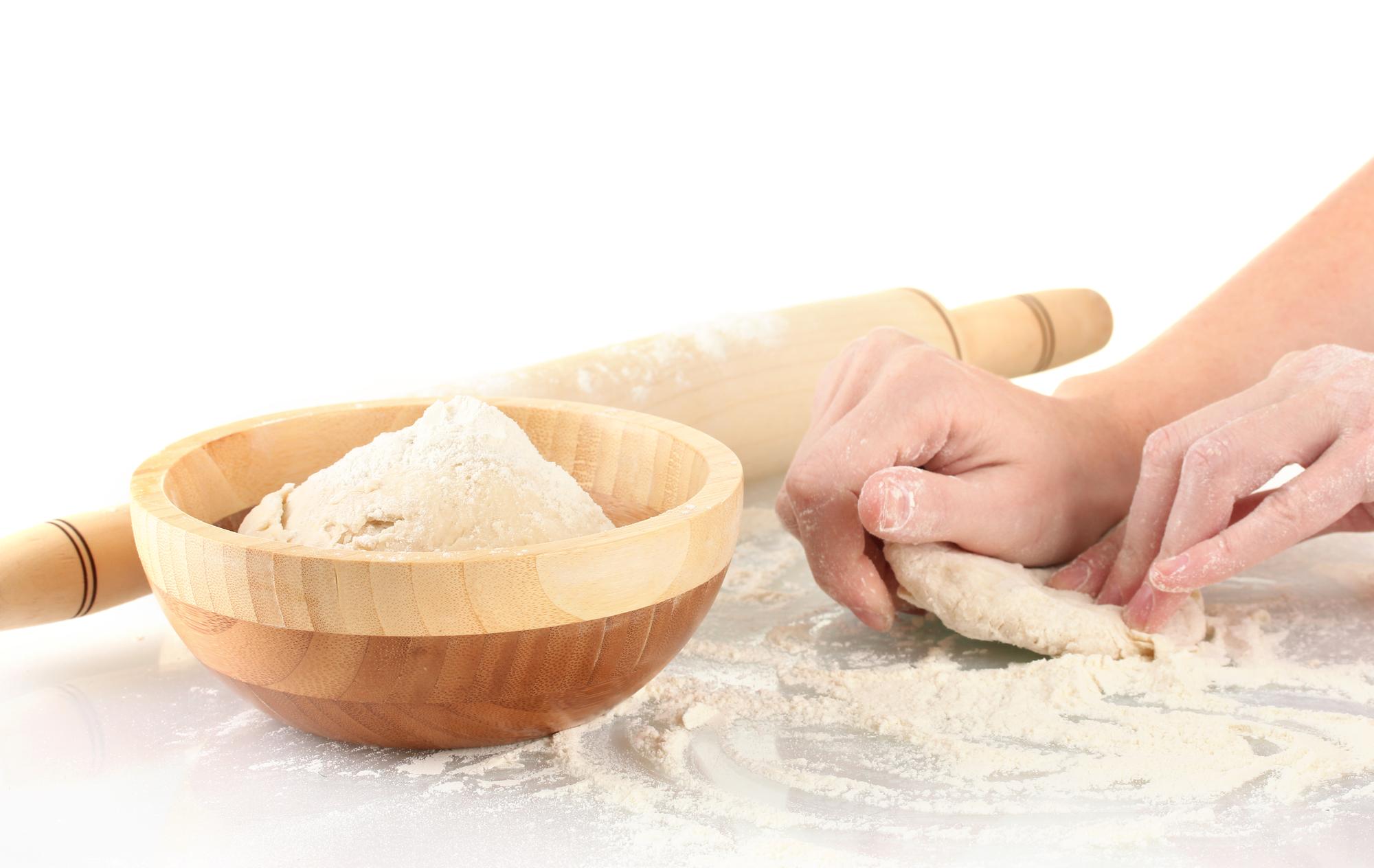 Hands preparing dough
